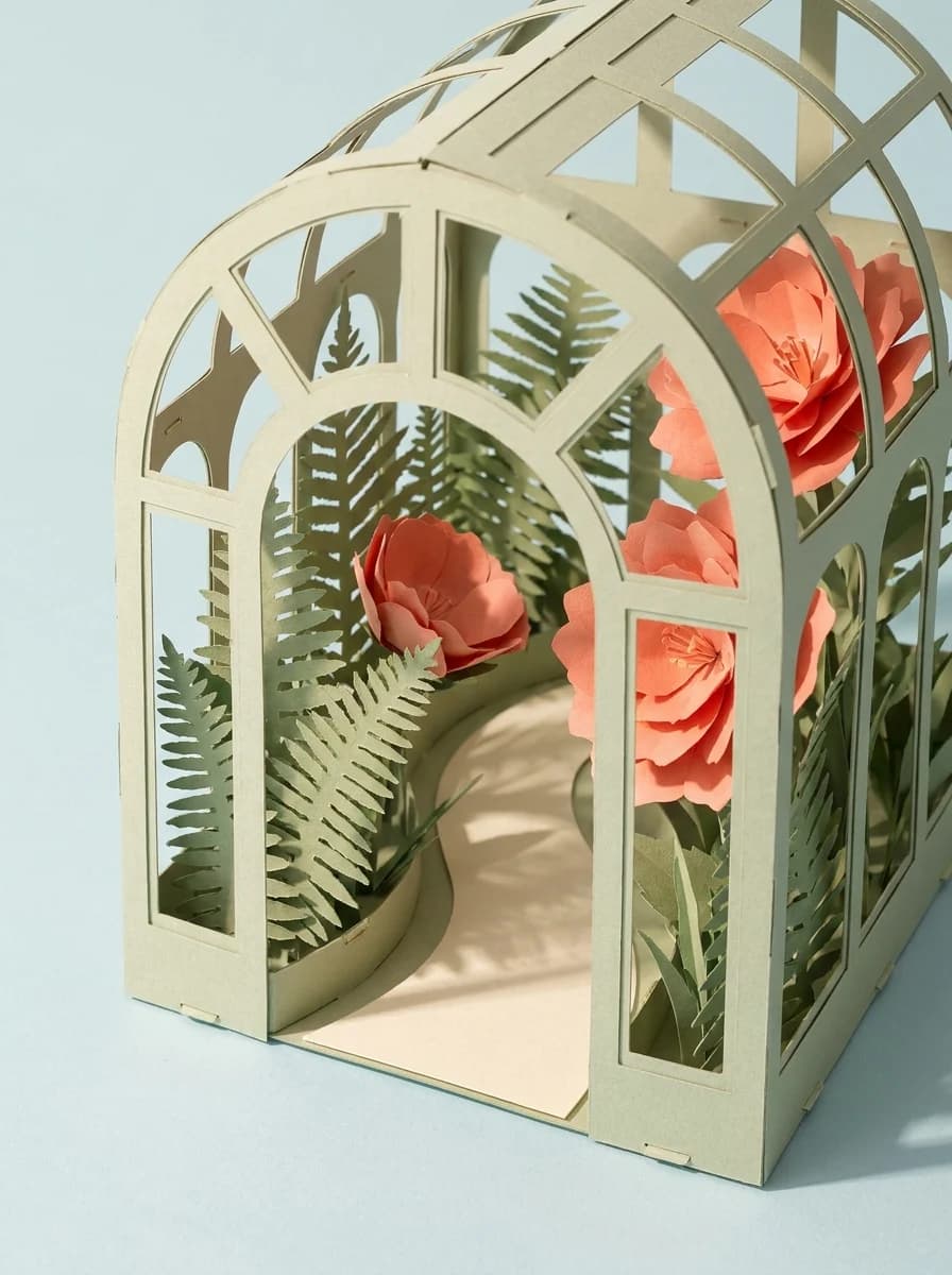 Paper conservatory with layered ferns and coral flowers